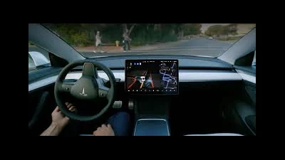 Full Self-Driving Tesla Says  (Supervised) Makes Driving Safer — But What Does That Really Mean?